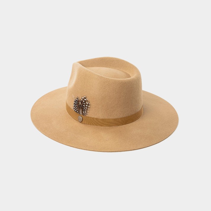 wide-brimmed felt hat decorated with feathers and buttons