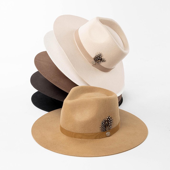 wide-brimmed felt hat decorated with feathers and buttons wide-brimmed felt hat decorated with feathers and buttons