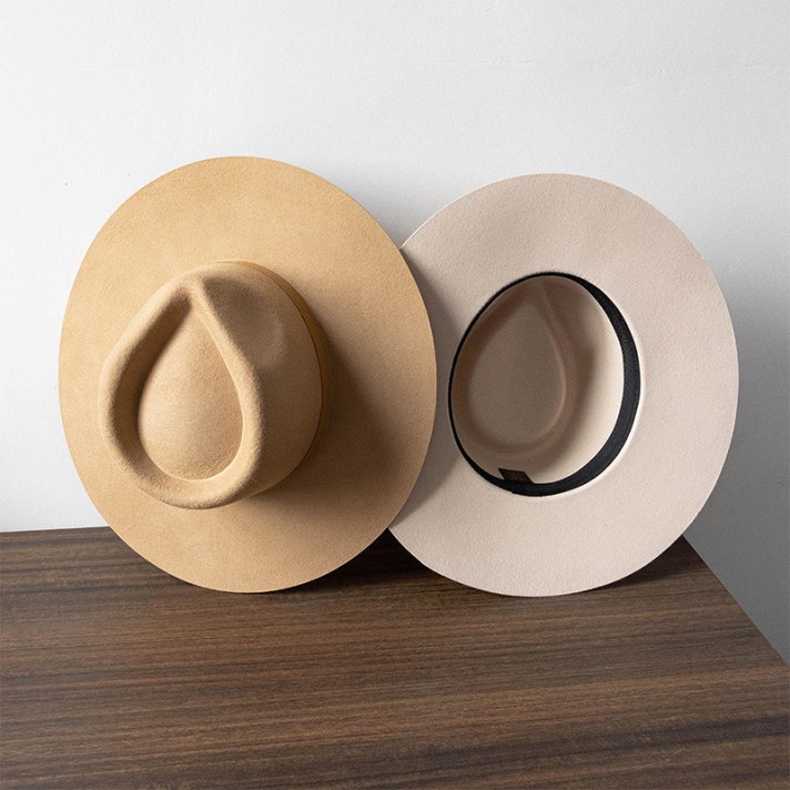 wide-brimmed felt hat decorated with feathers and buttons wide-brimmed felt hat decorated with feathers and buttons