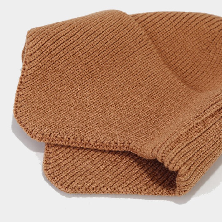 Simple dome-shaped knitted hat with ear flaps Simple dome-shaped knitted hat with ear flaps